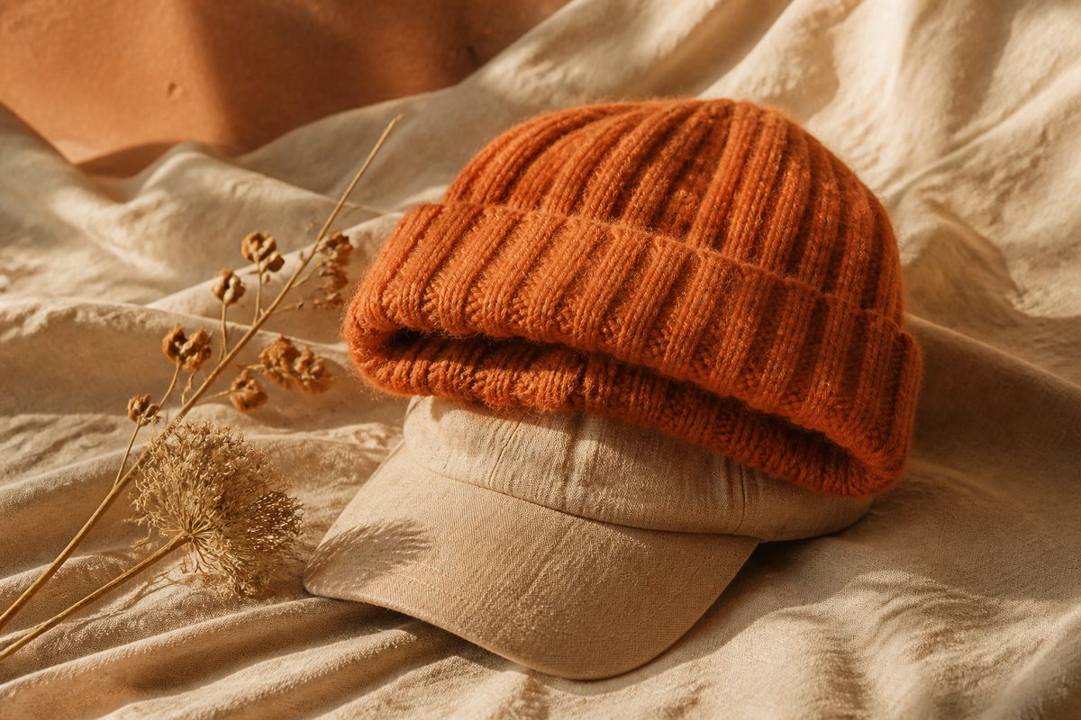 Beanie and cap on linen