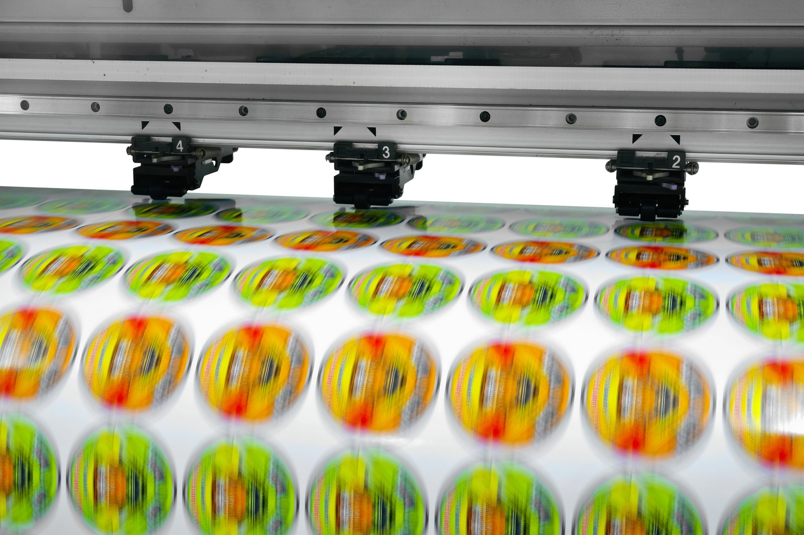 Circular stickers coming off the wide-format printer